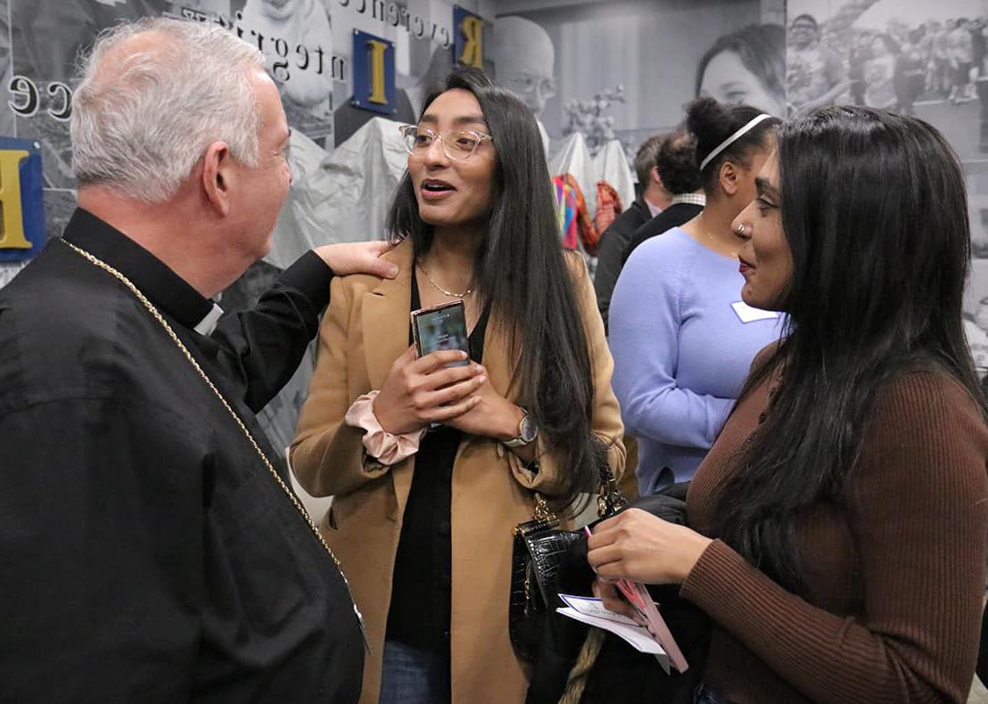 Holy Family students Kawish Sadaqat and Mehwish Sadaqat speak with Archbishop Nelson J. Pérez (Photo credit: Archdiocese of Philadelphia).